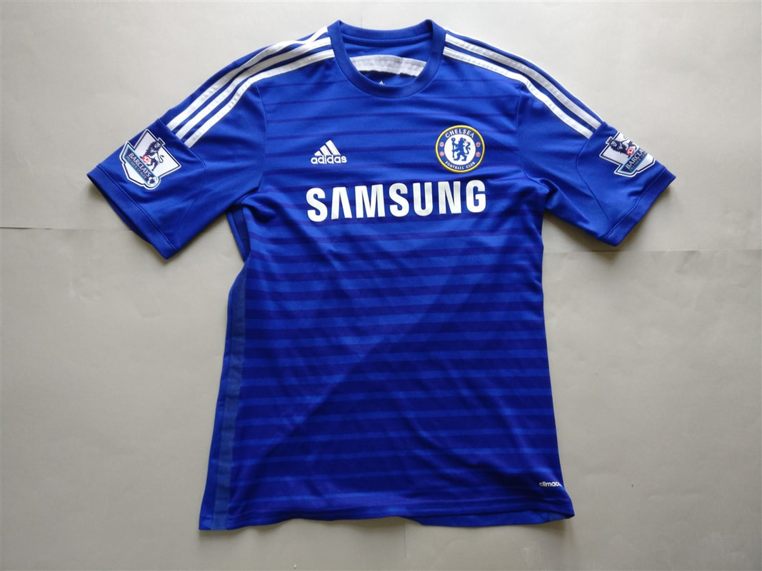 Chelsea F.C. Home 2014/2015 Football Shirt Manufactured By Adidas. The Shirt Is Sponsored By Samsung.