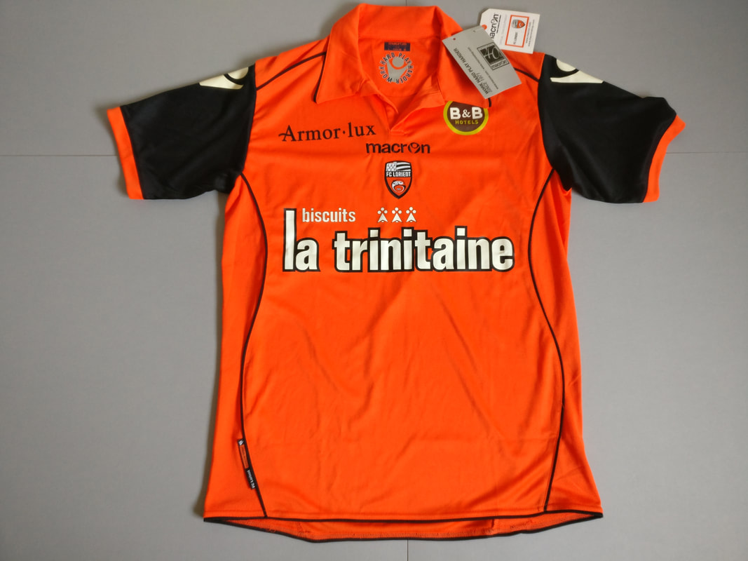 FC Lorient Home 2011/2012 Football Shirt Manufactured By Macron. The Club Plays Football In France.