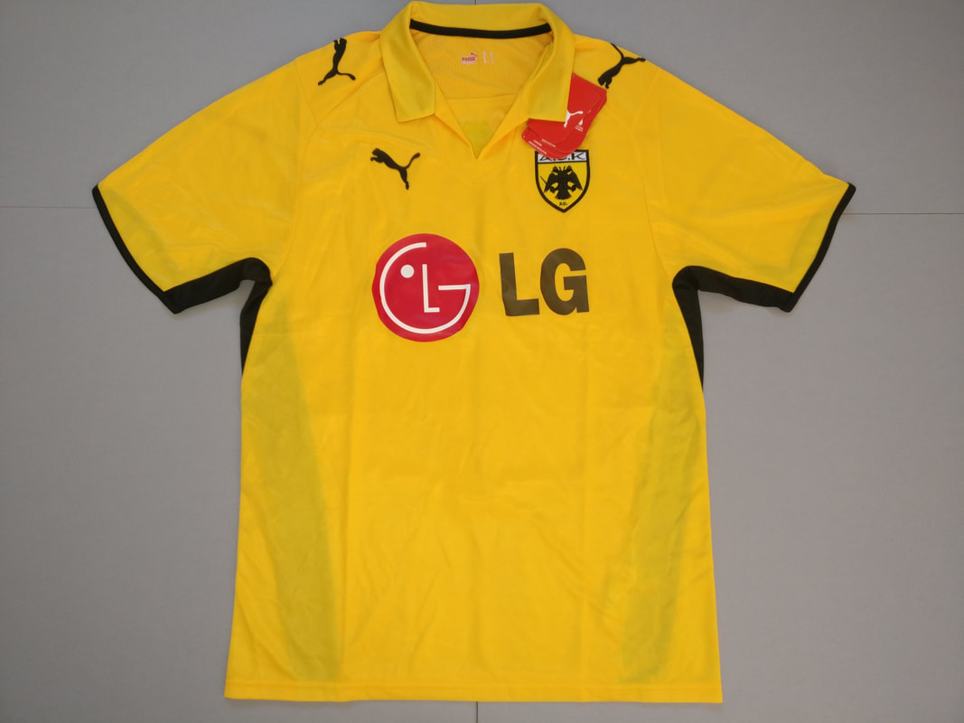 AEK Athens FC Home 2008/2009 Football Shirt Manufactured By Puma. The Club Plays Football In Greece.
