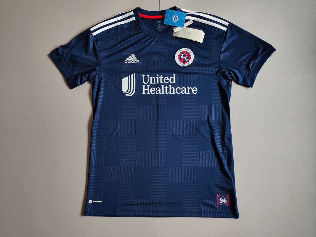 New England Revolution Home 2022 Football Shirt Manufactured By Adidas. The Club Plays Football In The United States.